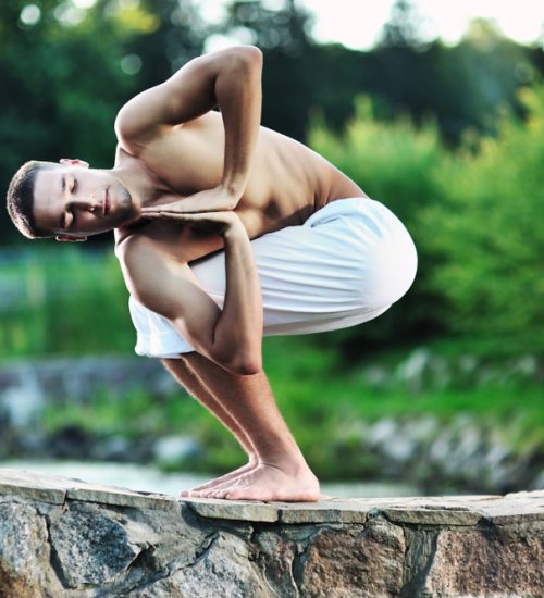 Young,Caucasian,Brunette,Man,Doing,Yoga,In,The,Park,At